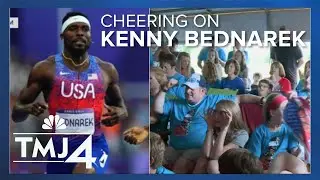 Supporters cheer on Rice Lakes Kenny Bednarek during 200m track final