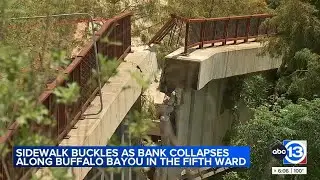 Complex's sidewalk, retaining wall buckles next to Buffalo Bayou