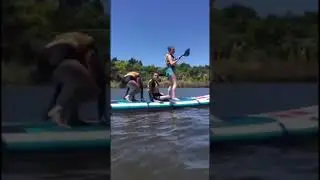 Group of People Fall Off Paddleboard When Prank Goes Wrong - 1311848