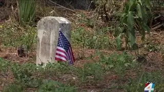 Church members put flags on graves of Black veterans at restored Jacksonville cemetery