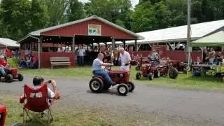 My son at the wheel horse tractor show.