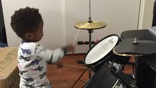 Baby playing drums