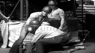 Men load shells in a 5 inch gun on board battleship New Mexico in the Pacific Oce...HD Stock Footage