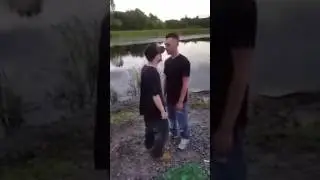 Funny video of two drunk guys fighting next to a lake