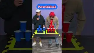 Men playing cups stacking challenge 