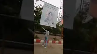 Brave young protestors clean the propaganda banners of the mullahs' dictatorship