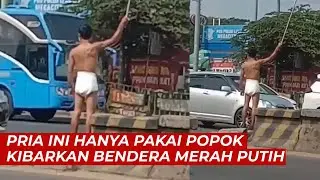 Viral, Pria Ini Hanya Pakai Popok Kibarkan Bendera Merah Putih di Pinggir Jalan