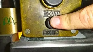 Ringing the elevator alarm in a vintage manually controlled Reading elevator