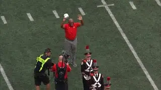 Archie Griffin dots the i in Script Ohio during halftime of Ohio State season opener