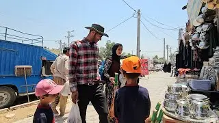 A rural family going to the city for shopping.  Babak buys summer🌞clothes for the children