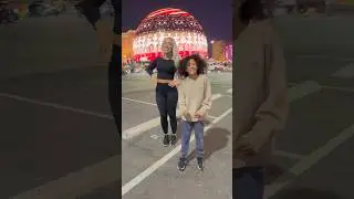 Mom and son Dancing in front of the Worlds Biggest Sphere 