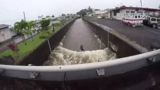 SURFER attempts to SURF STORM DRAIN after massive HURRICANE!!