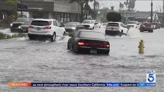 Rainstorm arrives, flooding roads and bringing snow to Southern California