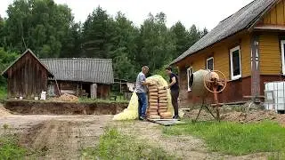 Renovation of an old house. Preparing a load-bearing wall for the terrace. Laying a sewer system