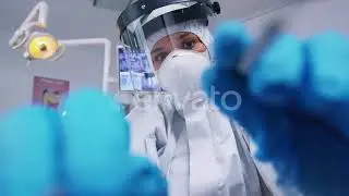 Pov of Dentist in Ppe Suit Working on Patient Mouth Hygine | Stock Footage - Envato elements