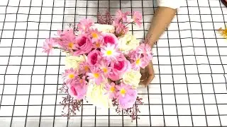 Share flower arrangements combining white roses, daisies and roses