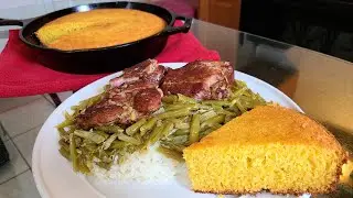 French Style Green beans and neck bones over rice with cast-iron skillet cornbread