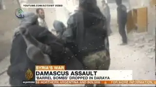 Barrel bombs hit Syrian suburb of Daraya