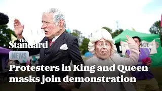 Extinction Rebellion protesters in Charles and Camilla masks join Windsor Great Park demonstration