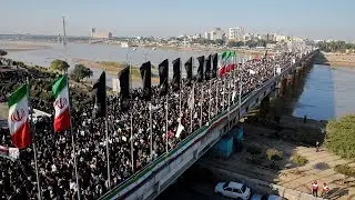 Thousands march in grand funeral procession for Iranian General Soleimani