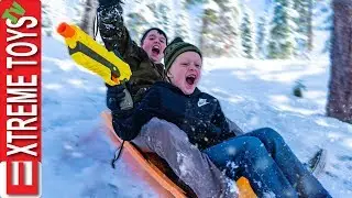 Last Day of Spring Break Snow Mayhem! Ethan VS. Cole Sledding Nerf Blast!