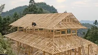 The man building an ancient Chinese style wooden house in 4 years. Skilled Chinese carpenters