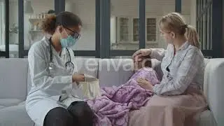 Female Pediatrician Doing Medical Checkup at Home | Stock Footage - Envato elements