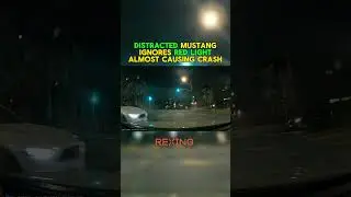 Distracted mustang ignored redlight at intersection #driving #youtubeshorts #shorts #ytshorts