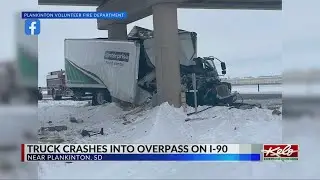 Truck crashes into bridge on I-90