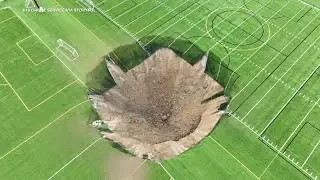 Sinkhole opens up on soccer field, swallows light pole in seconds