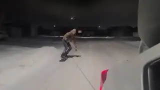 Guy Snowboards On Street While Being Pulled By Car Through Rope - 1169653