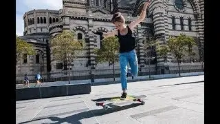 girl doing longboard tricks - Cassandre Lemoine Landyachtz team rider