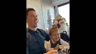 Cristiano Ronaldo laughs while playing with his daughter. His laugh is terrible