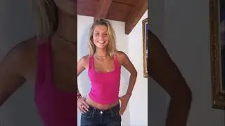 Beautiful blonde in Pink top showing cleavage and Nice smile