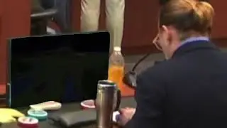 Johnny Depp watching minecraft while in court
