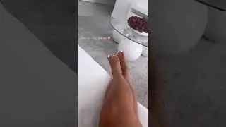 girl puts on white toenails   