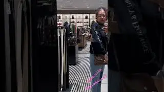 At Coach Outlet trying on Aston . She is cute 🥰.