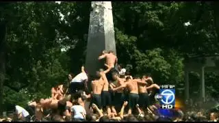 Naval Academy plebes climb the monument