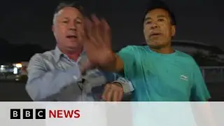 The moment BBC China reporter is pushed away from filming at car attack scene | BBC News