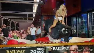 Hot blonde Bull riding in too short white miniskirt is showing thong. Hot upskirt booty ass