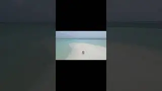 Walking in sandbank Maldives