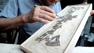 The process of an old Korean craftsman making a signboard out of solid wood.