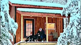 a great day at the off grid cabin , cooking, campfires, and dogs!