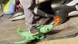 Stepping and popping an inflatable dragon