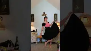 Dainty Rascal dancing in vintage black & pink lace dress