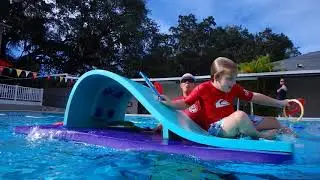 4 year old lil seal does obstacle course across 25 yard pool!!!!