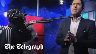 Armed men invade live TV broadcast in Ecuador