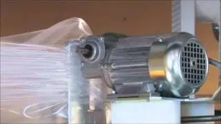 Упаковка сухих строительных смесей в стретч-худ пленку. Машина Powert Flex T1, Lachenmeier, Дания