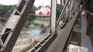 Unusual Train Ride in India: Thieves Hide Under Bridge
