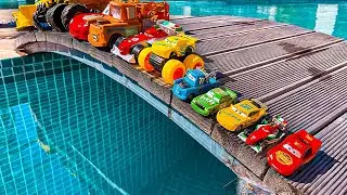 Disney Pixar Cars falling into deep pool, Lightning McQueen, Tow Mater, Mack, Sally, Francesco